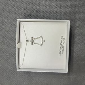 Silver bell holiday necklace